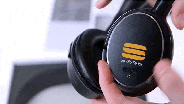 Gif shows a pair of hands opening the battery compartment on the ANX-10 Headphones.
