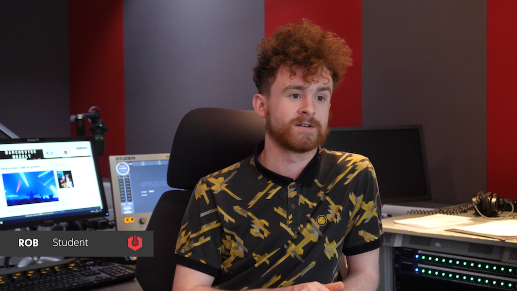 Image shows a Salford University student in one of their creative suites.